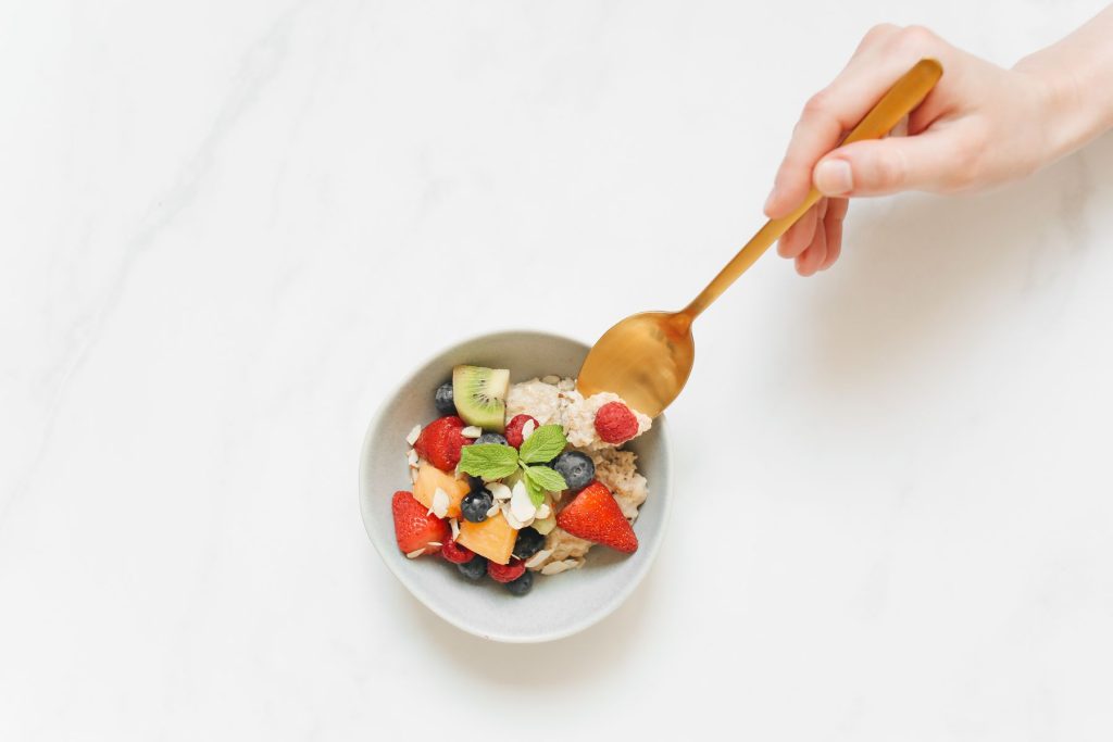 Fruit and oat breakfast bowl from above
