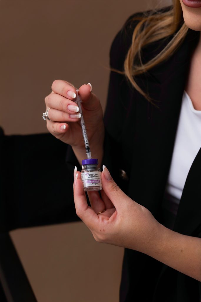 Hands examining a small vial and its packaging